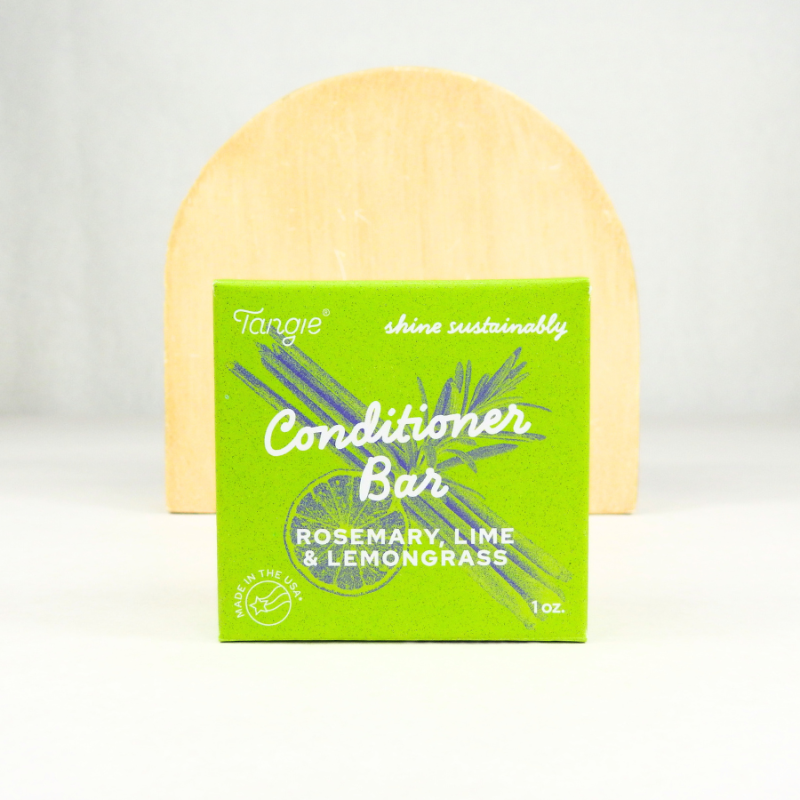 Plastic-free conditioner bar with rosemary, lime, and lemongrass essential oils in green Tangie packaging. Ideal for natural haircare and eco-conscious consumers.